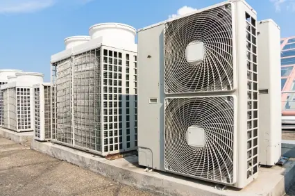 Rooftop air conditioning condenser units installed on a commercial building